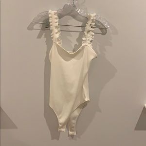 Ripped white bodysuit